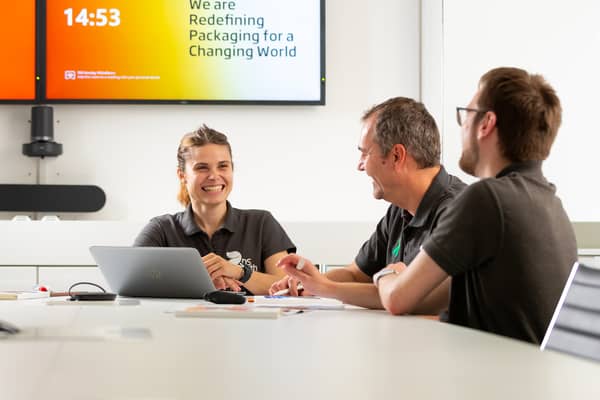 Smiling woman in meeting