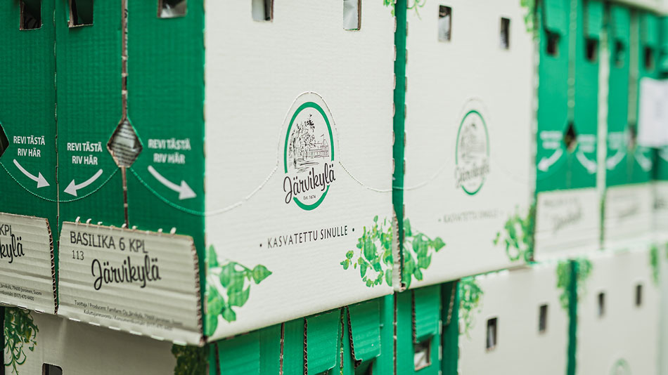 aaltopahvisia Järvikylä-brändin laatikoita kuvassa