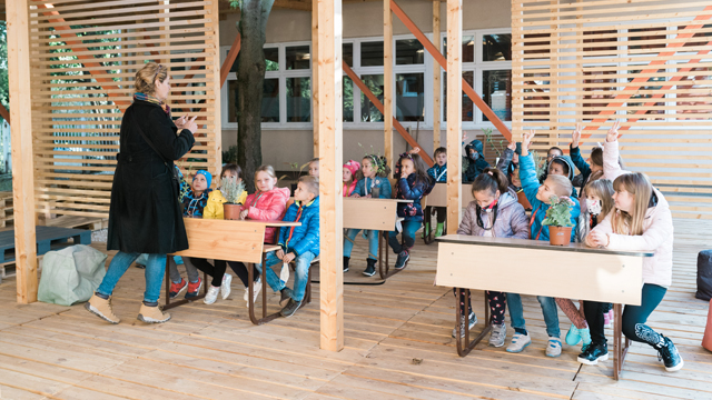 An eco-classroom with rainwater collection system, solar panels, organic garden and compost - creating a space for inspiring education and stimulating eco-consciousness
