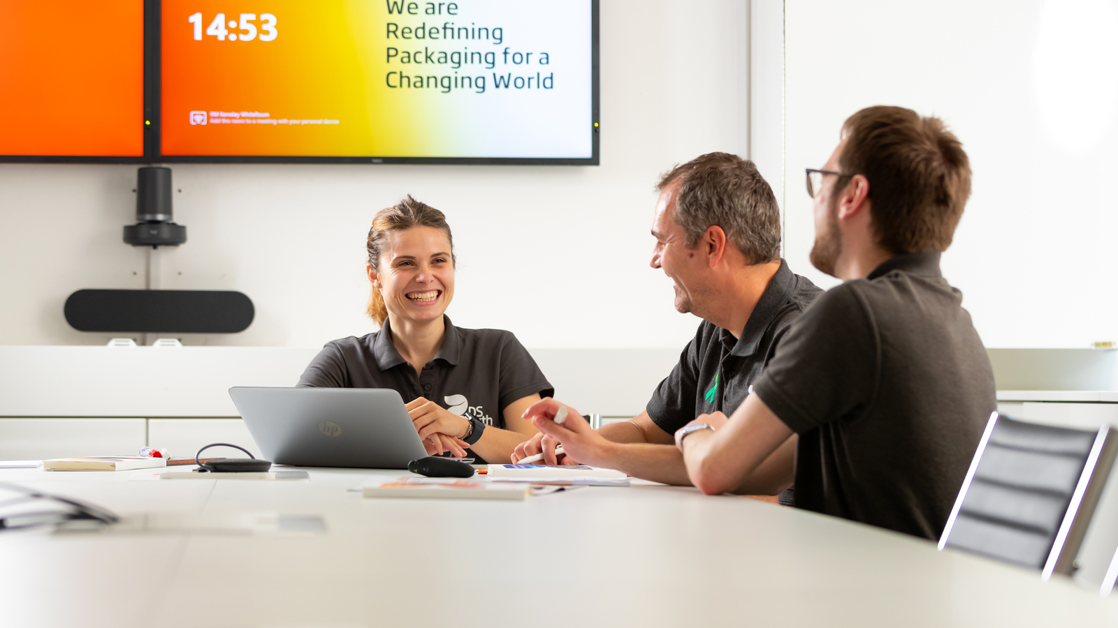 Smiling woman in meeting
