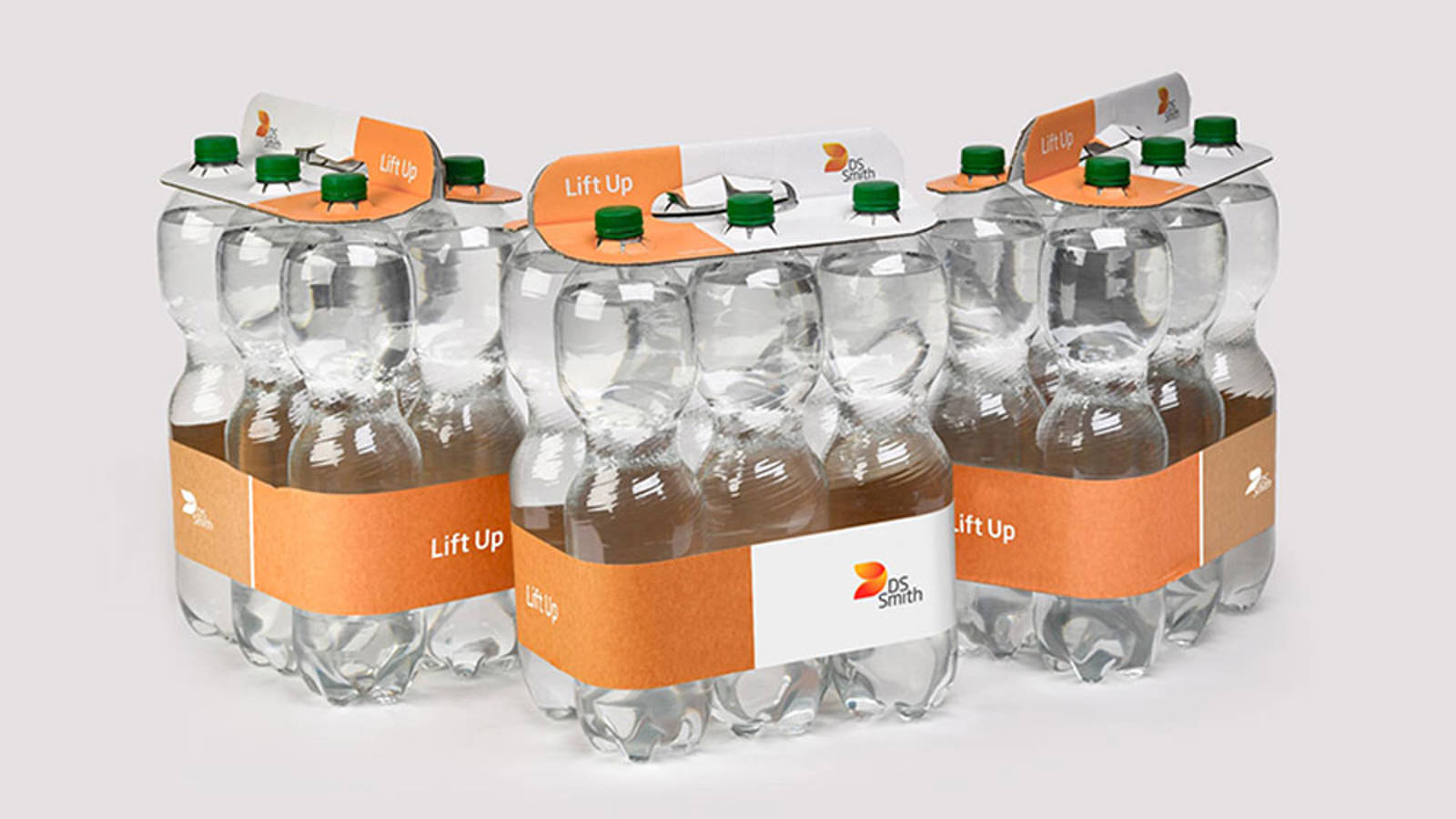 PET-pulloja joissa ei ole muovikalvoa ryhmäpakkauksessa vaan pahvinen kahva ja paperipanta