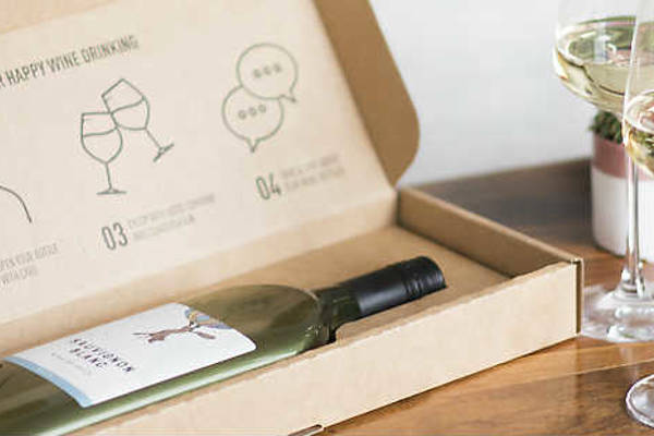 Open box of Garcon wine on a table