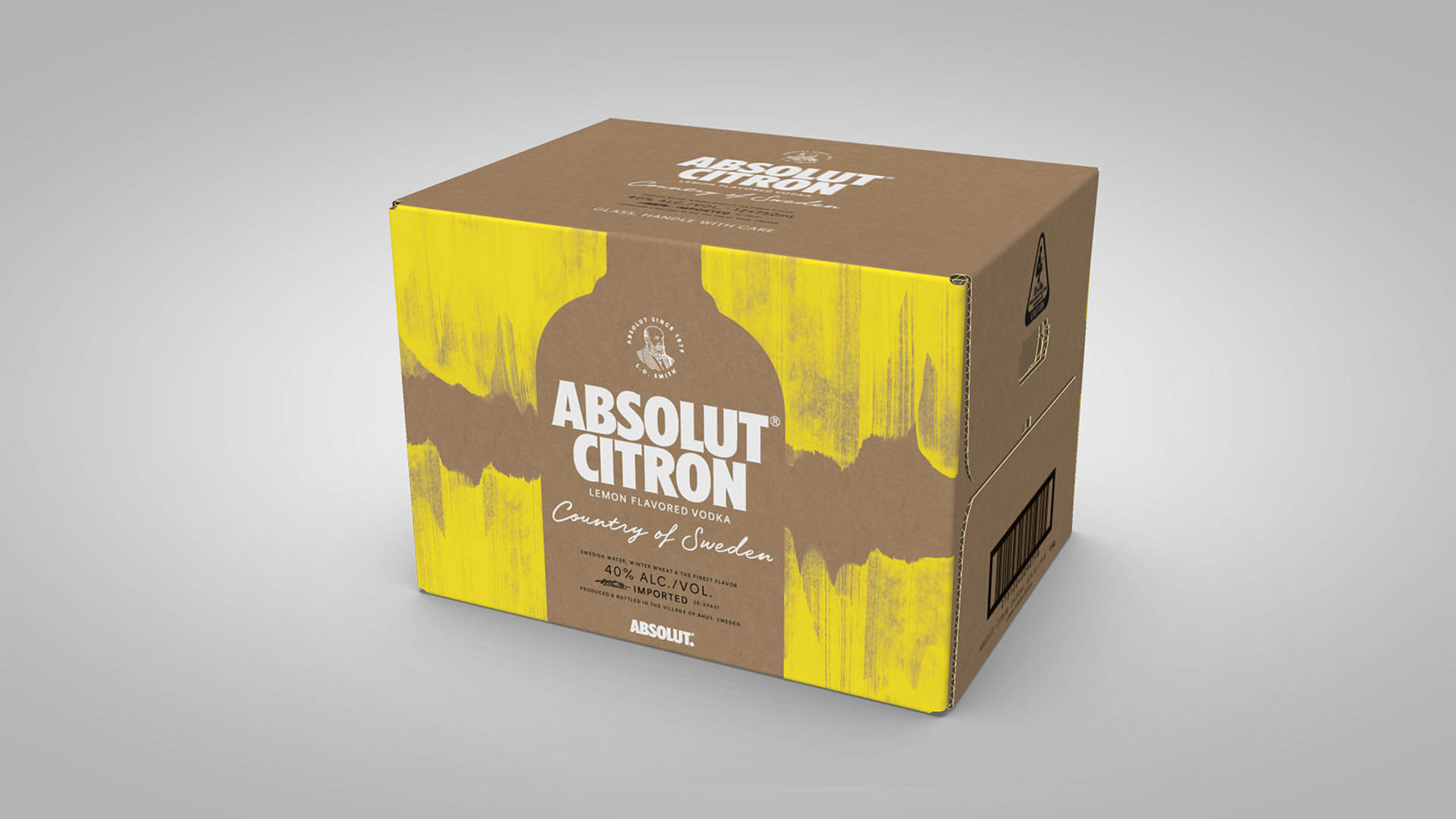 Brun  papkasse med gult print og hvid tekst Absolut Vodka