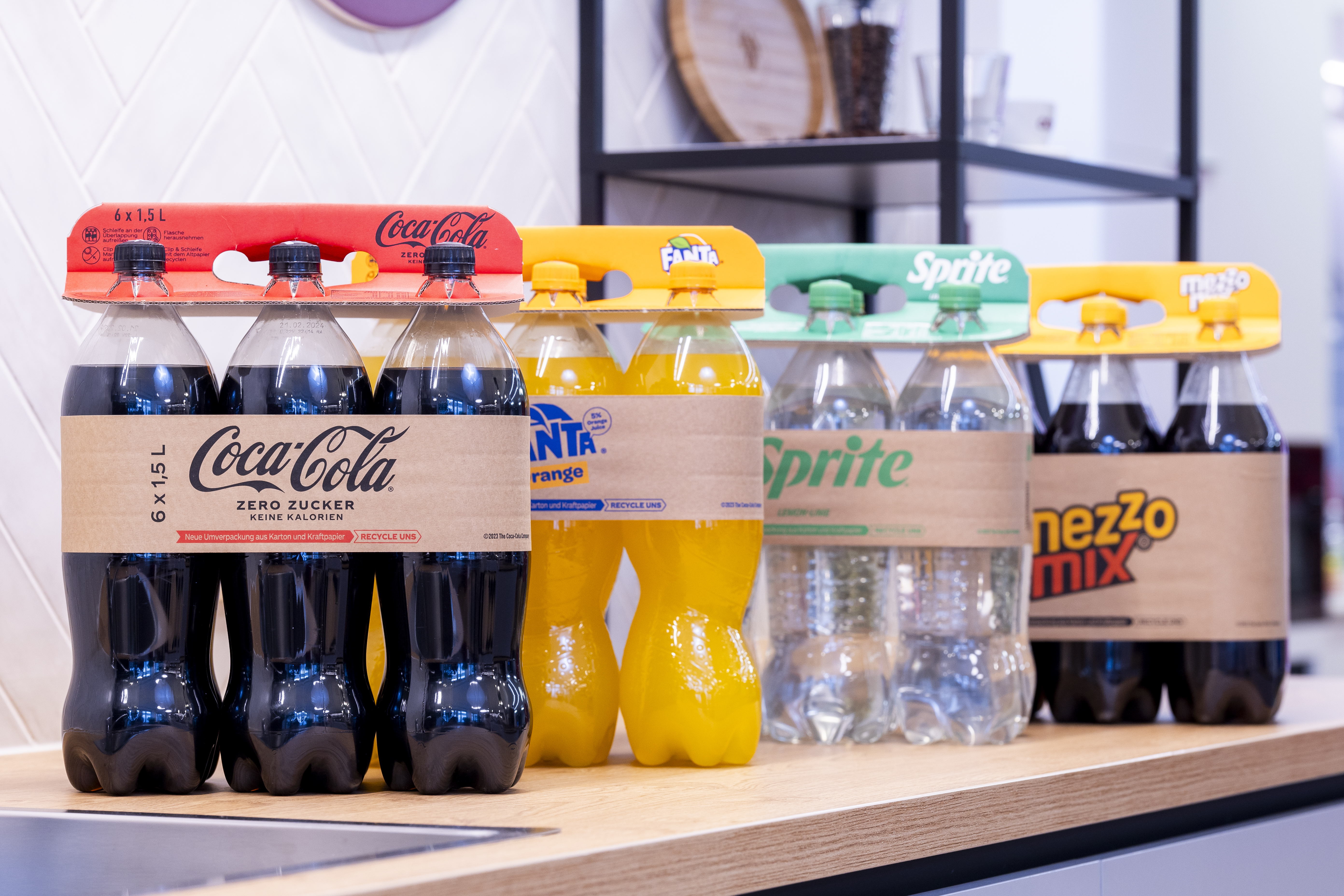 Coca cola a fully recyclable, fibre-based alternative to plastic shrink-wrap for rigid bottle multi-packs